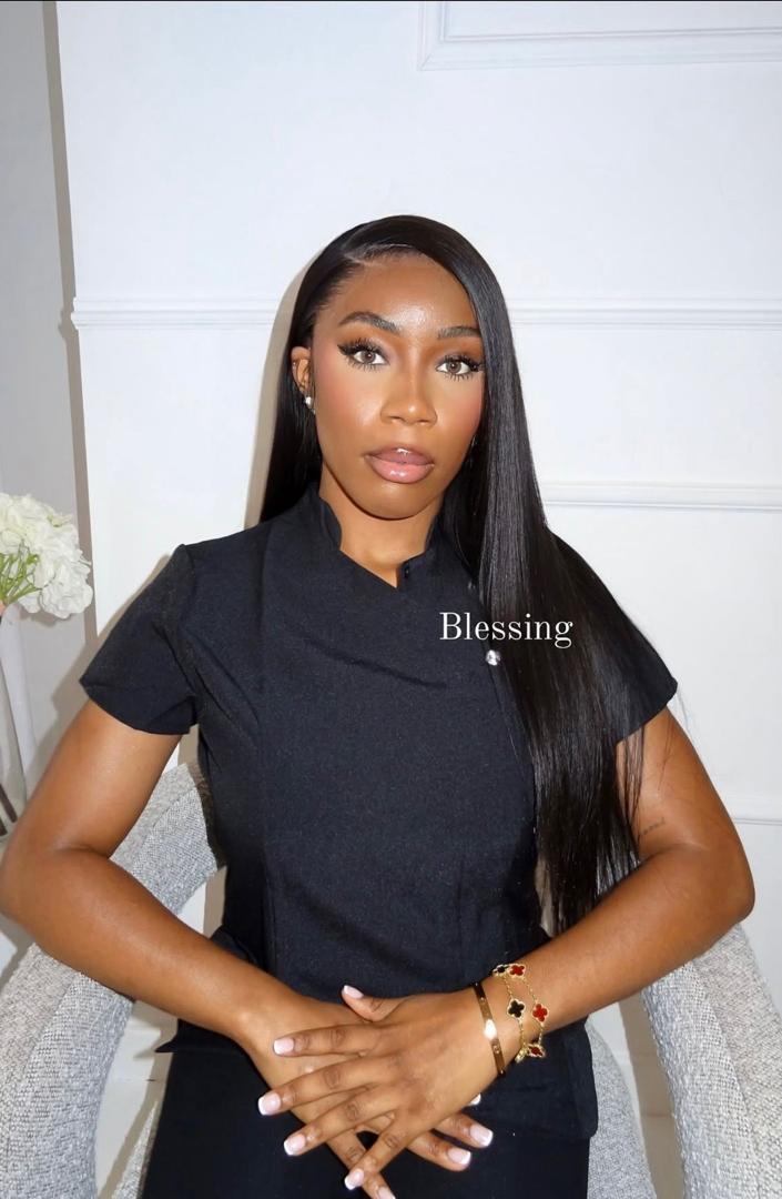 Portrait of Blessing in black scrubs
